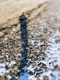 High angle view of pebbles on beach