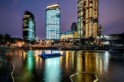 Illuminated buildings in city at night