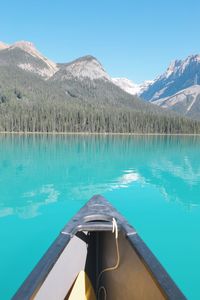 Reflection of mountains in lake against blue sky