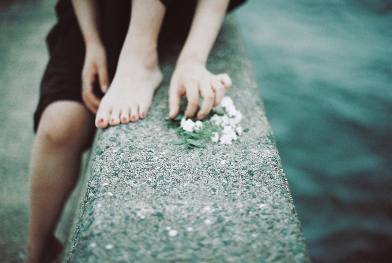 human body part, body part, real people, day, rock, barefoot, one person, leisure activity, close-up, focus on foreground, low section, human leg, lifestyles, outdoors, nature, hand, human hand, rock - object, water, human foot, finger, human limb