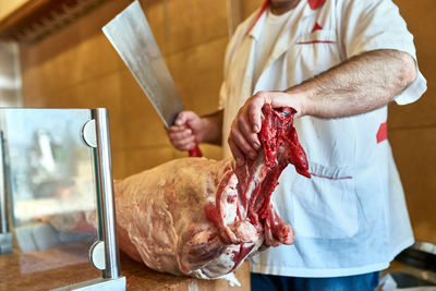 Midsection of man holding food