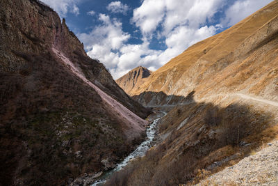 View of mountain range against cloudy sky