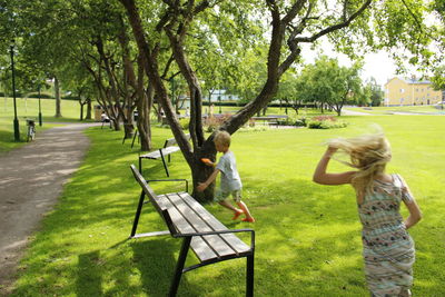 High angle view of siblings playing at park