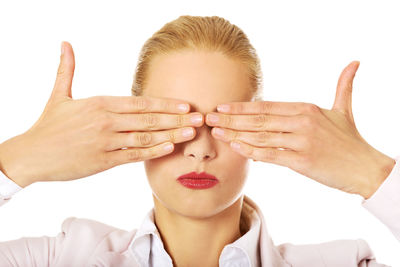 Close-up of woman hand against white background