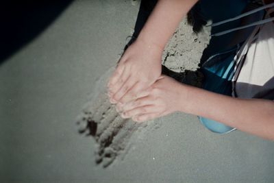 Low section of man on sand