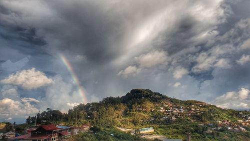 Panoramic view of rainbow over mountain