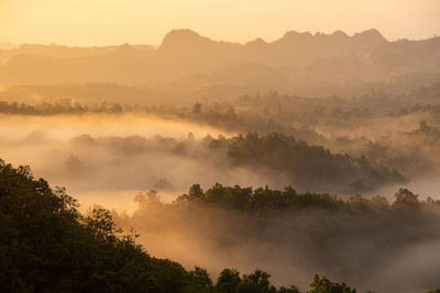 Scenic view of mountains against sky during sunset