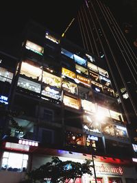 Low angle view of illuminated city at night