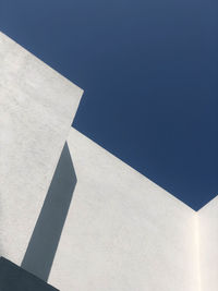 Low angle view of building against blue sky