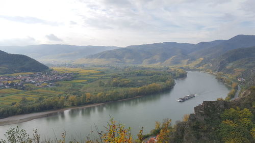 Scenic view of danube river and mountains against sky