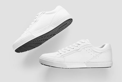 Close-up of shoes over white background