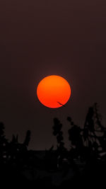 Silhouette trees against sky during sunset