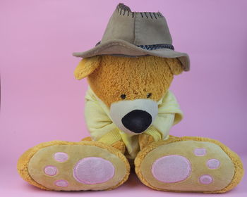 Close-up of stuffed toy against pink background