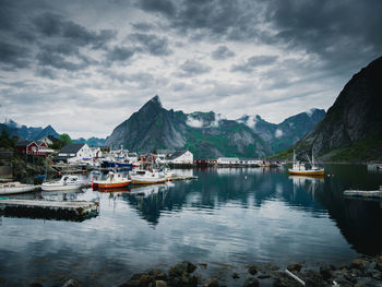 Sailboats moored in bay