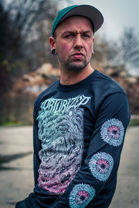 Portrait of young man standing outdoors