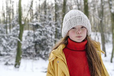 Portrait of a smiling woman in snow