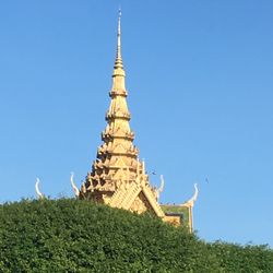 View of temple against clear blue sky