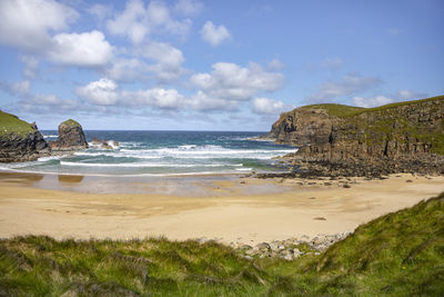 Scenic view of beach against sky