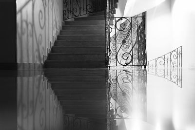 Reflection of steps on flooring in building