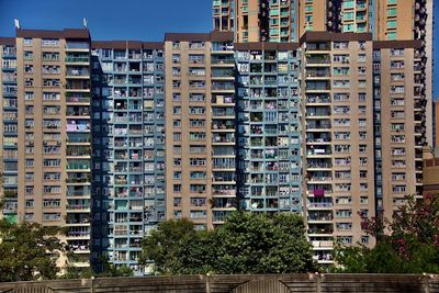 Low angle view of tall buildings against clear sky