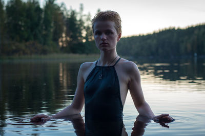 Close up pretty woman wearing swimsuit in lake portrait picture