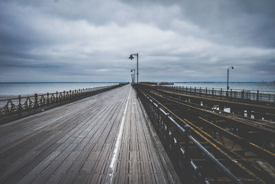 Road by sea against sky