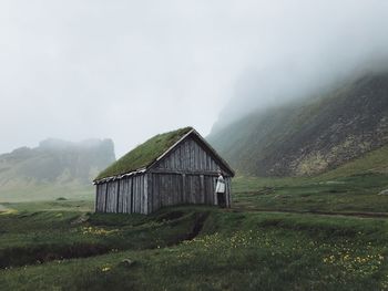 Built structure on field against sky