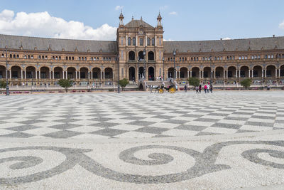 People in front of historic building