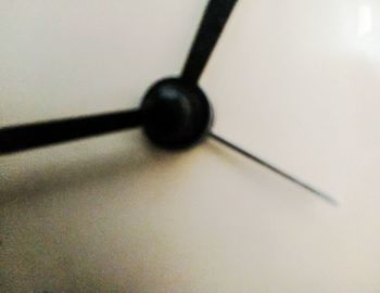 Close-up of eyeglasses on table against white background