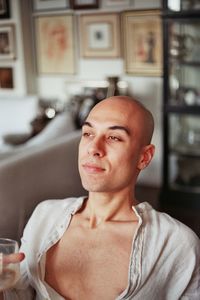 Portrait of young man sitting at home