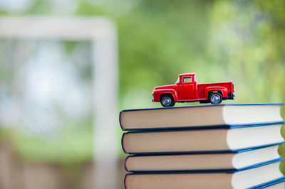 Toy car on stacked books at home