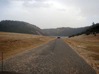 Country road passing through landscape