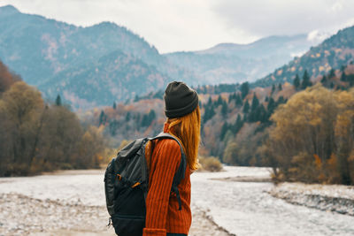 Rear view of man looking at mountains