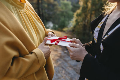 Hands holding present