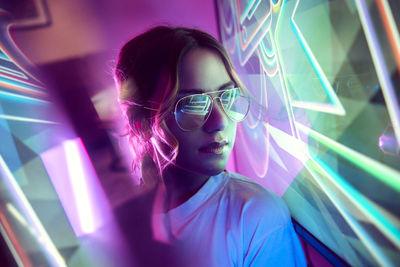 Neon portrait of a girl with glasses