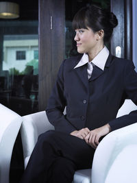 Young woman sitting in car