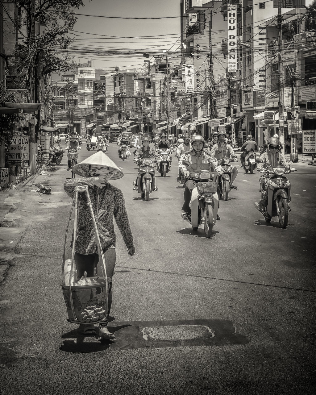 PEOPLE RIDING MOTORCYCLE ON STREET