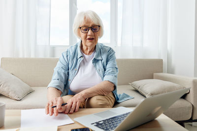 Portrait of doctor working at home