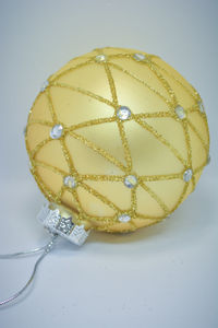 Close-up of christmas bauble over white background