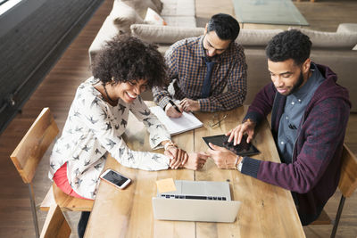 High angle view of business people working at desk in office