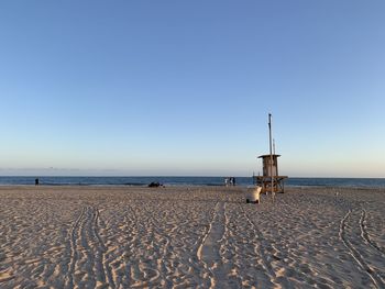 Scenic view of beach against clear sky