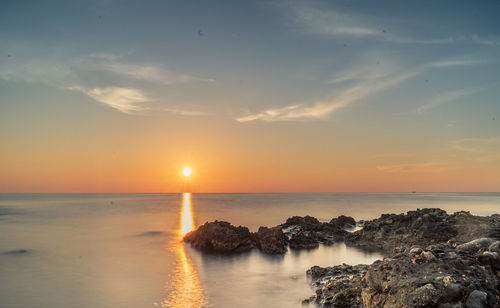 Scenic view of sea against sky during sunset