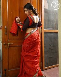 Woman standing against door