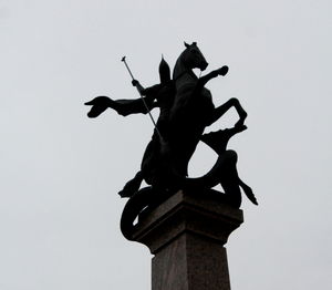 Low angle view of statue against sky