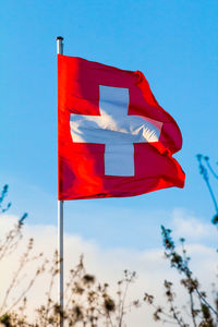 Low angle view of flag against sky