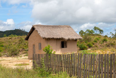 House on field against sky