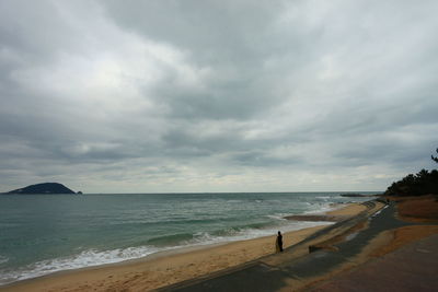 Scenic view of sea against cloudy sky