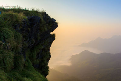 Scenic view of mountains against sky at sunset