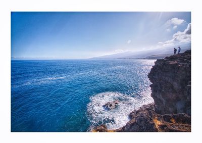 Scenic view of sea against blue sky