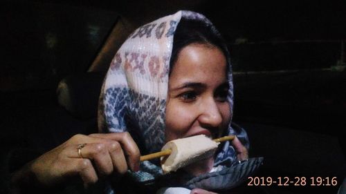 Portrait of young man eating food